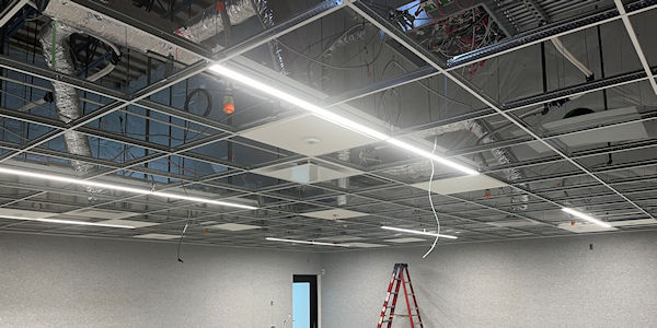 Installing new grid for new acoustical ceiling tiles